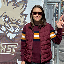 Kristi Troxel with Boko and hand sign